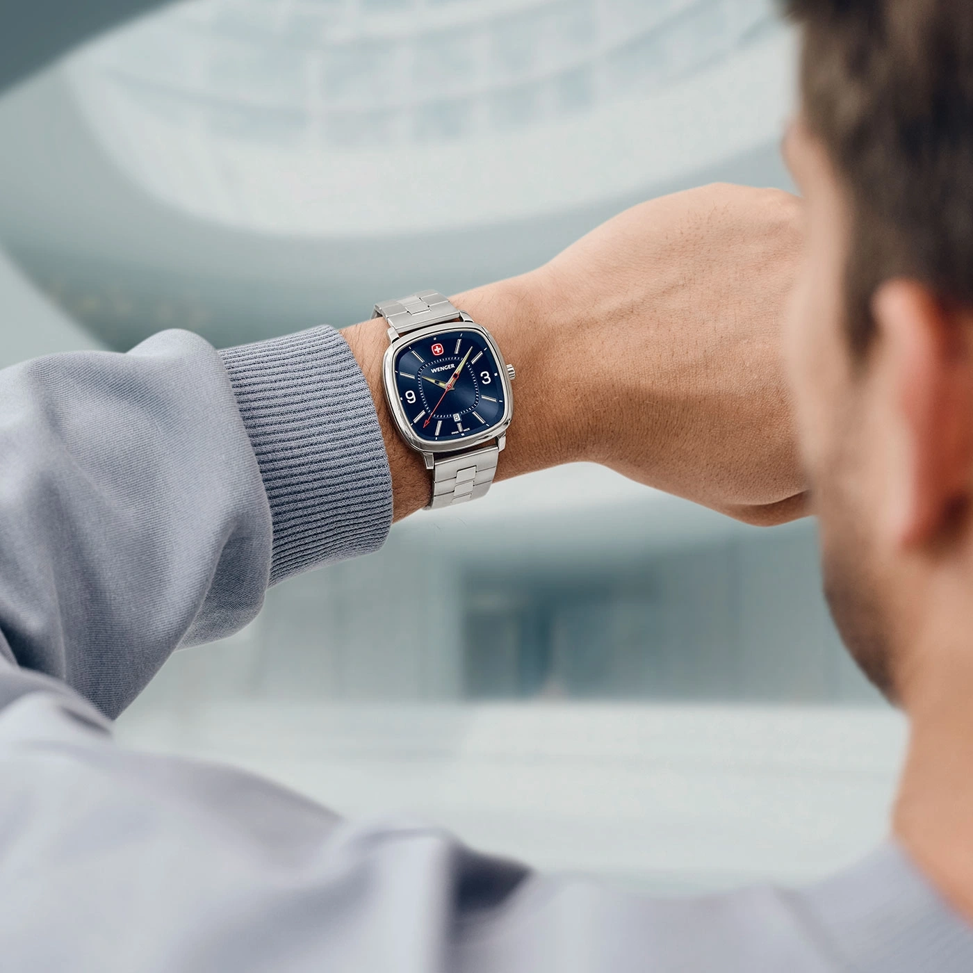 Man wearing a watch on his wrist, close-up shot of the watch