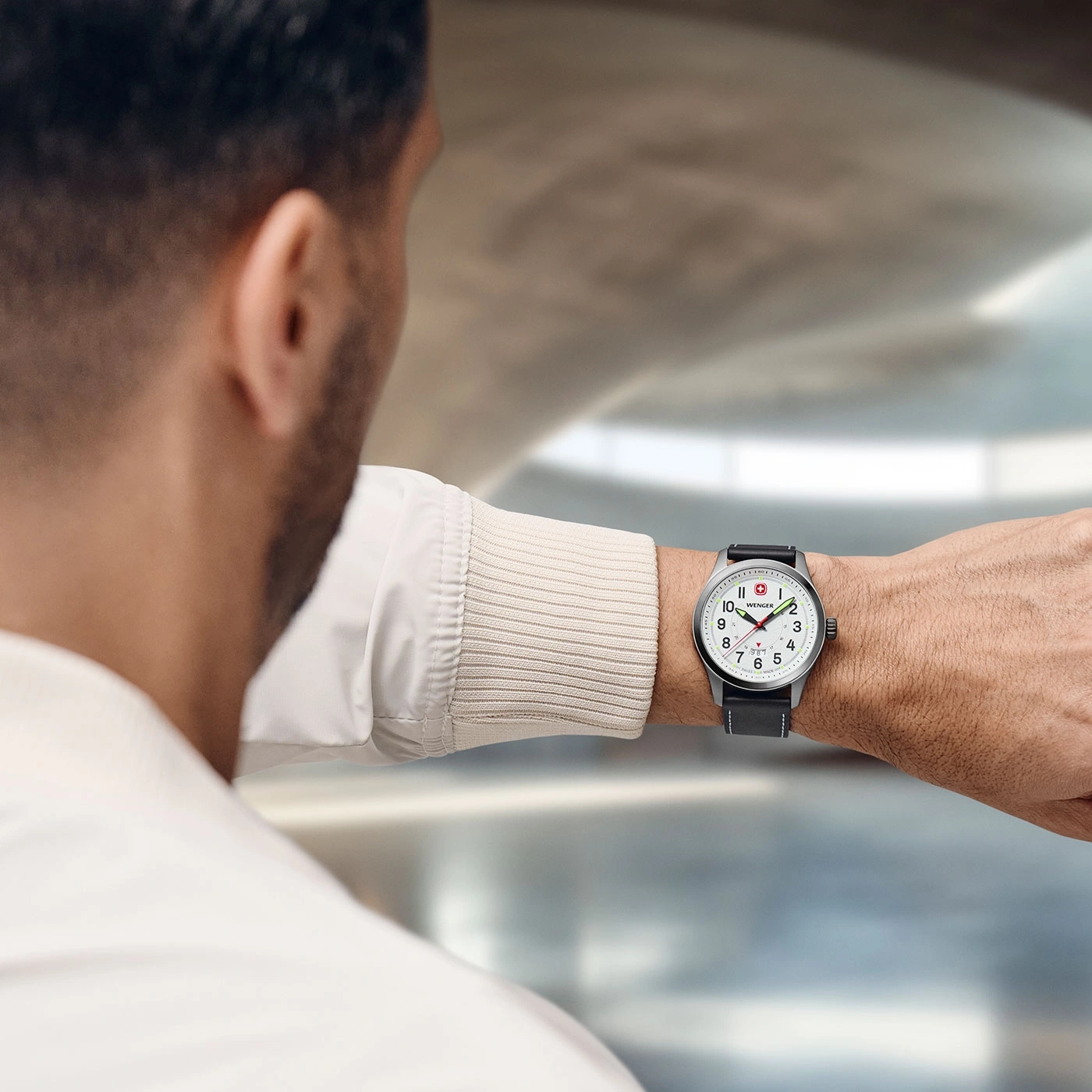 Man wearing a watch on his wrist, close-up shot of the watch