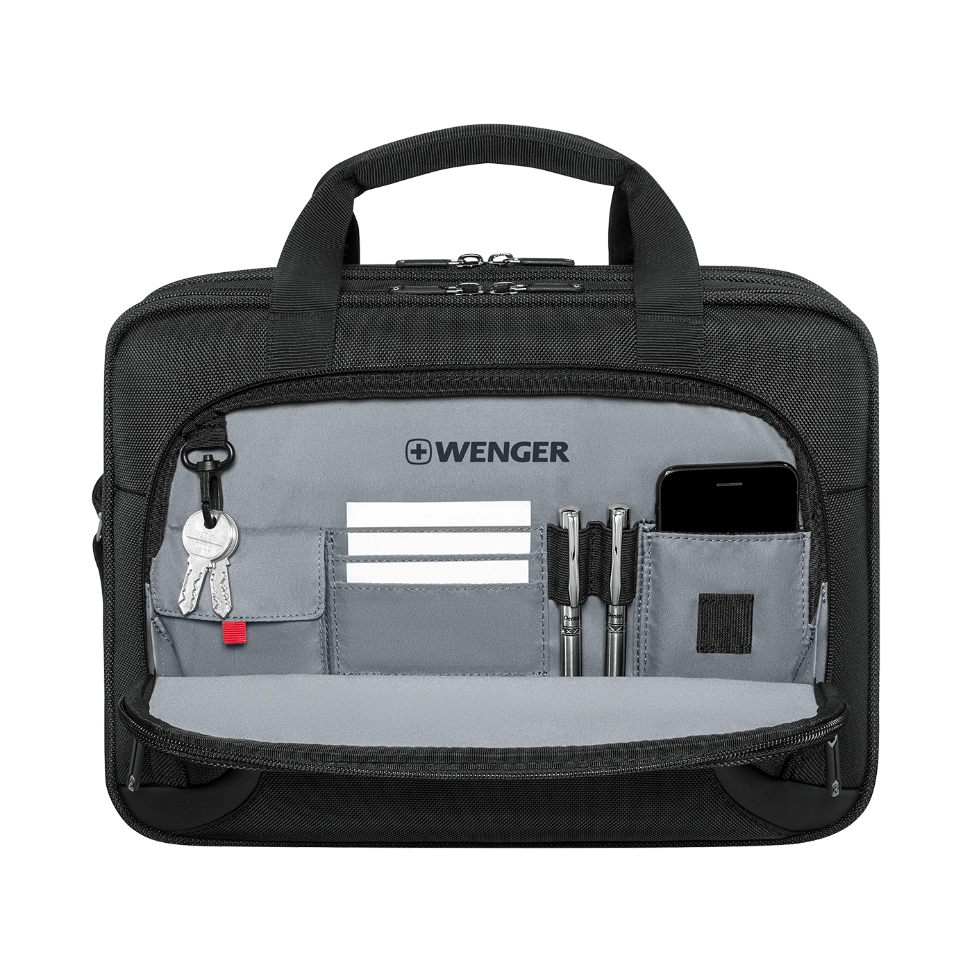Black briefcase with open compartment, pens, phone, and keys inside.