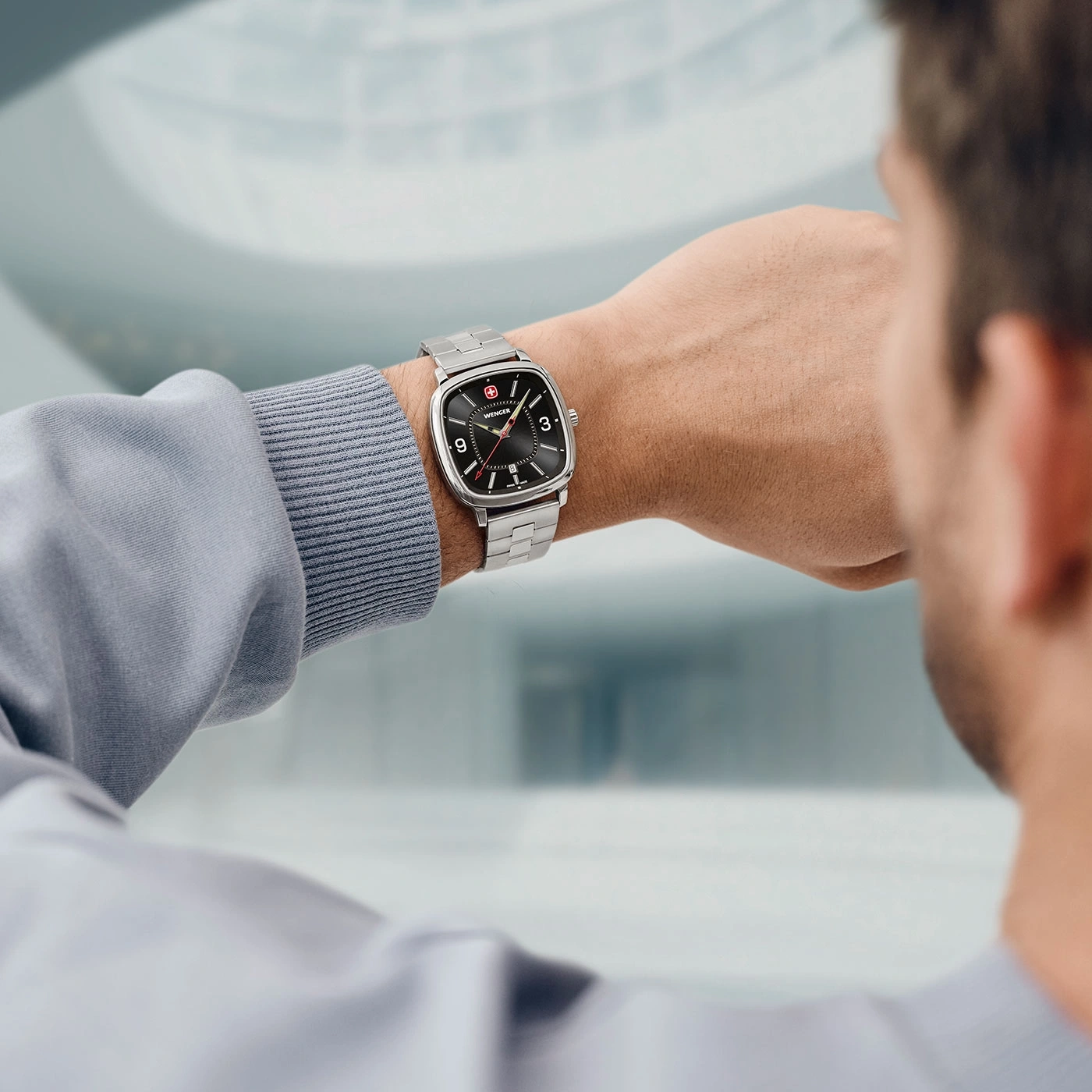 Man wearing a watch on his wrist, close-up shot of the watch