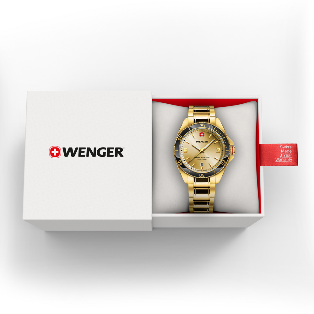 Gold Wenger watch in box with red tag and warranty information.