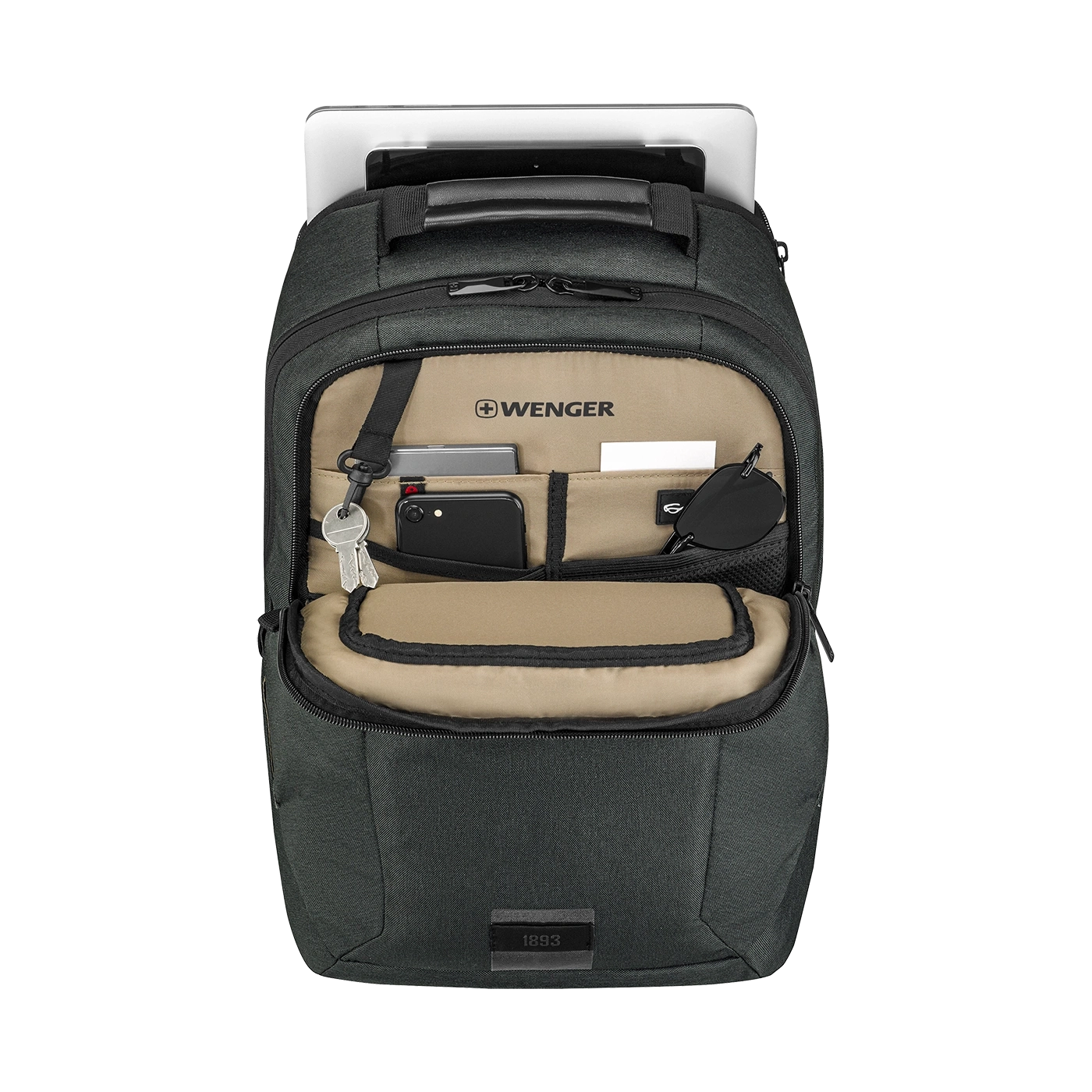 Black backpack with open compartment, tablet, and various accessories.