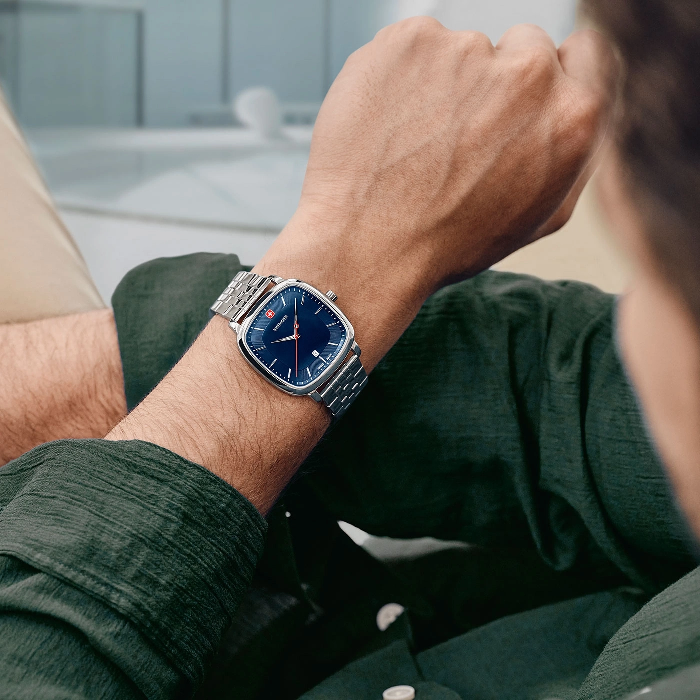 Man wearing a watch on his wrist, close-up shot of the watch