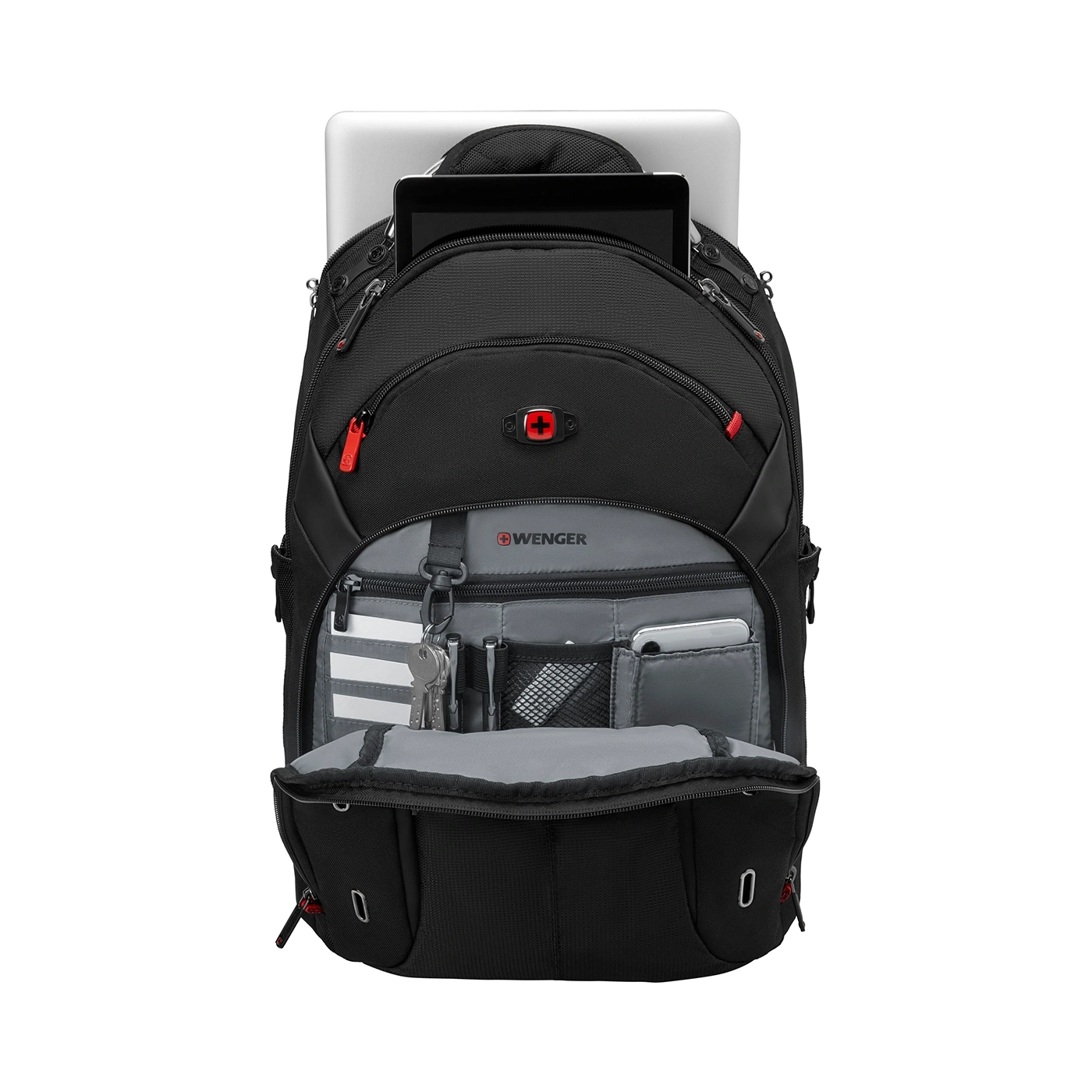 Black backpack with laptop, tablet, and accessories, open on a black background.