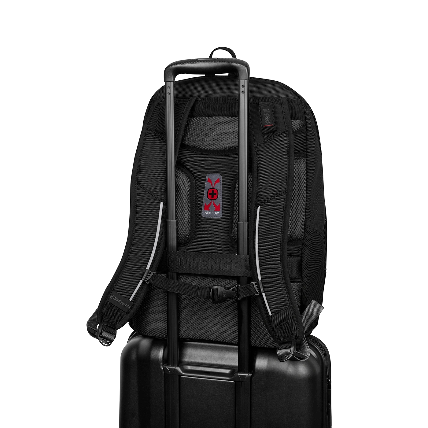 Black backpack on a suitcase with Airflow logo and Wenger branding.