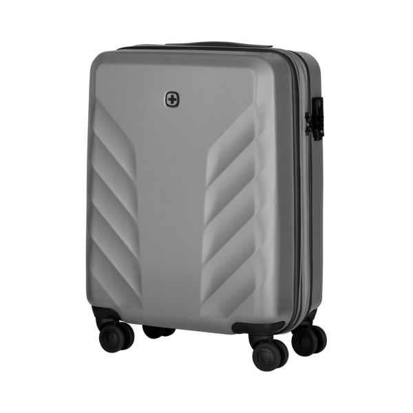 Gray suitcase with wheels and lock isolated on a black background.