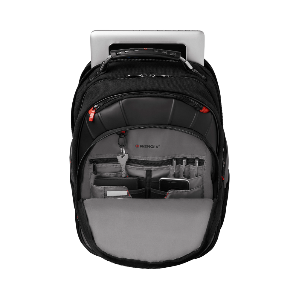Black backpack with laptop and accessories, open on a black background.
