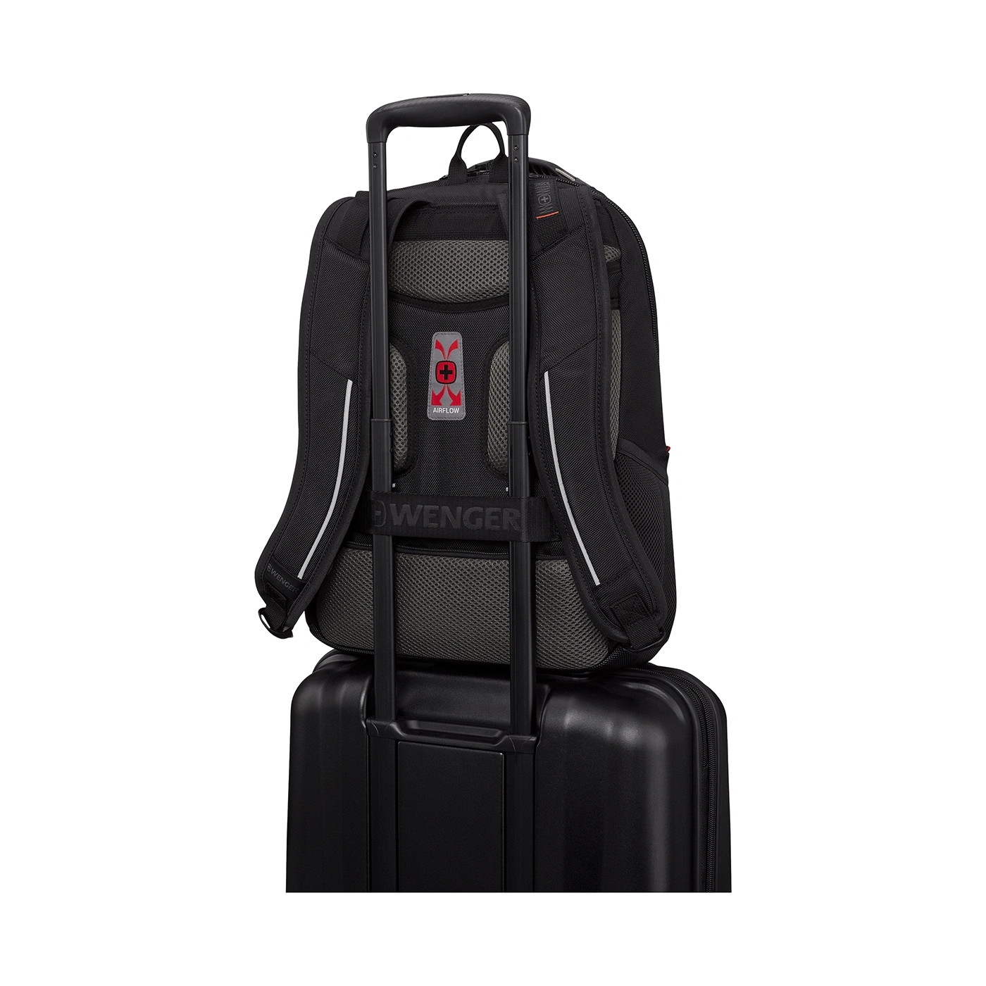 Black backpack on a black suitcase with handle. Wenger logo and Airflow system.