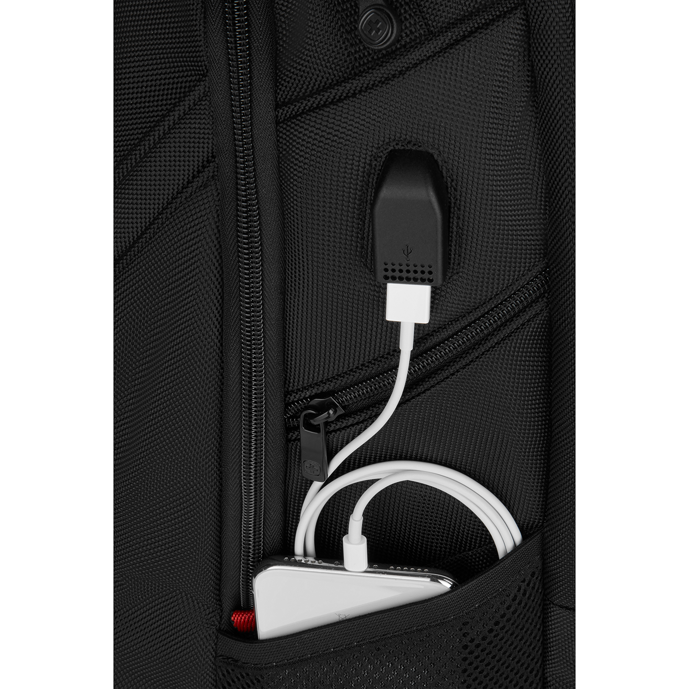 Black backpack with USB port and smartphone in the pocket, charging