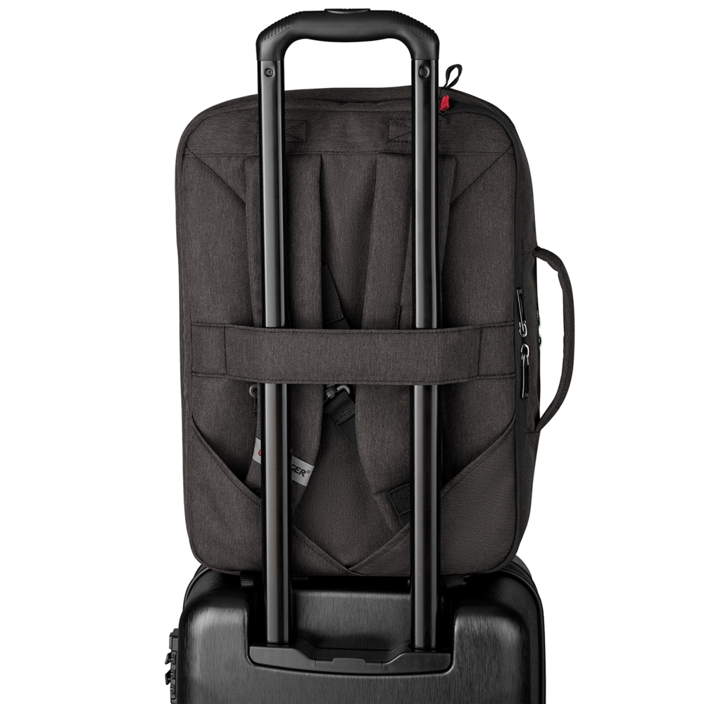 Black backpack on a suitcase with a retractable handle, ready for travel.