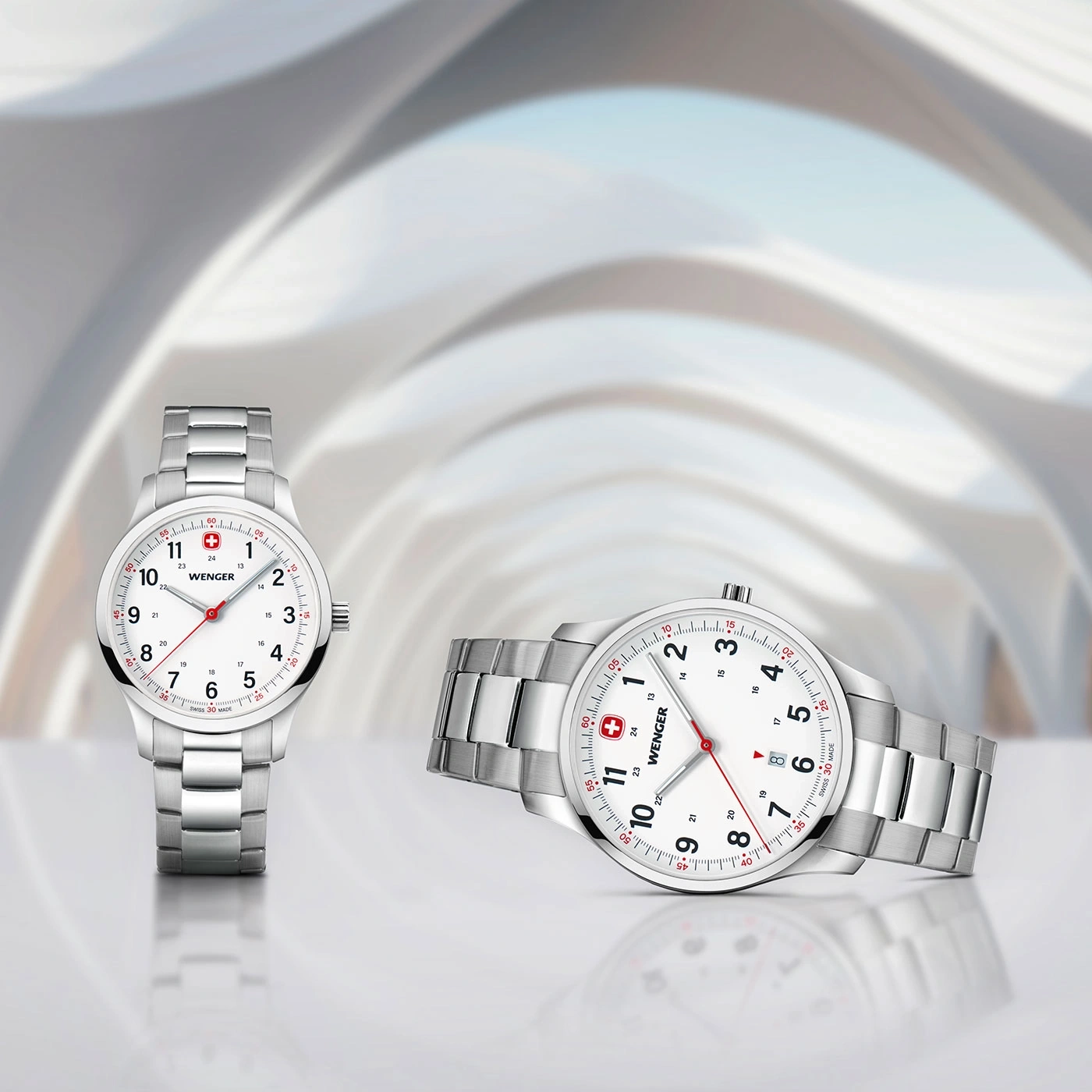 Two Wenger watches with silver bands and white faces, close-up shot, elegant and stylish.