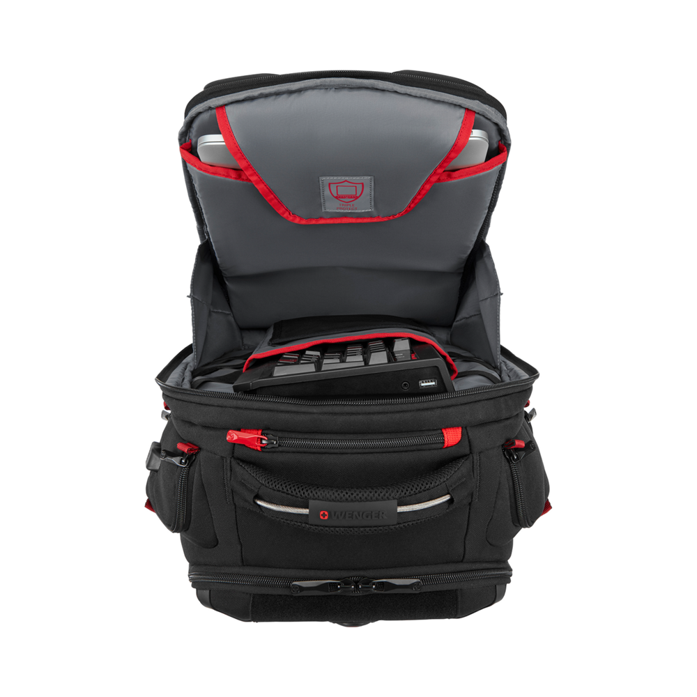 Black backpack with red accents, open, with laptop and keyboard inside.