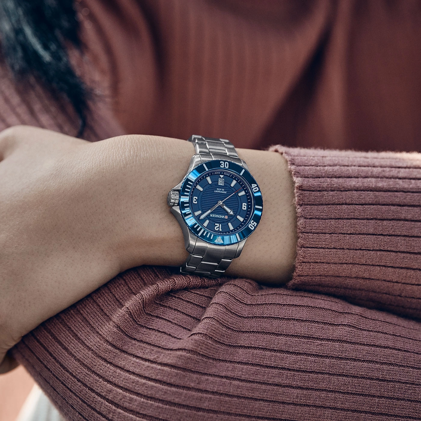 Watch on wrist, blue dial, silver bracelet, Wenger, 20 ATM, 200M/660FT, Swiss Made