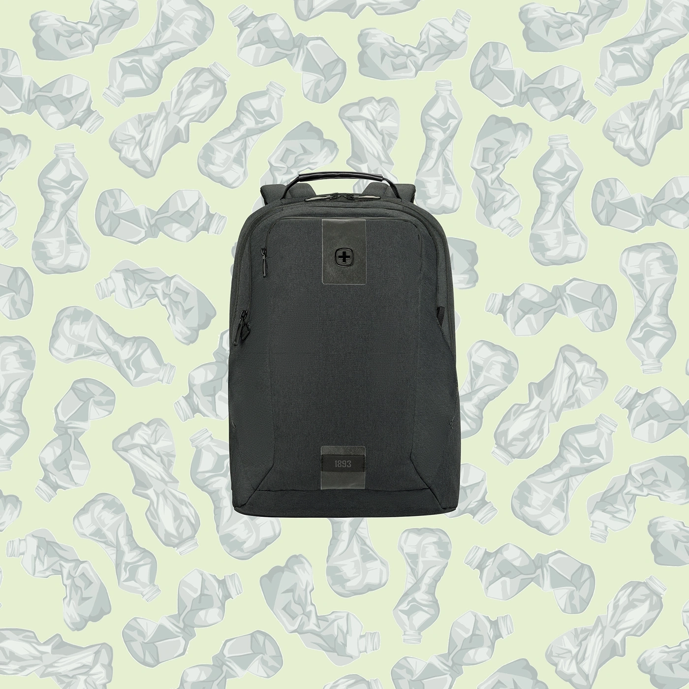 Black backpack in front of a background of crumpled plastic bottles.