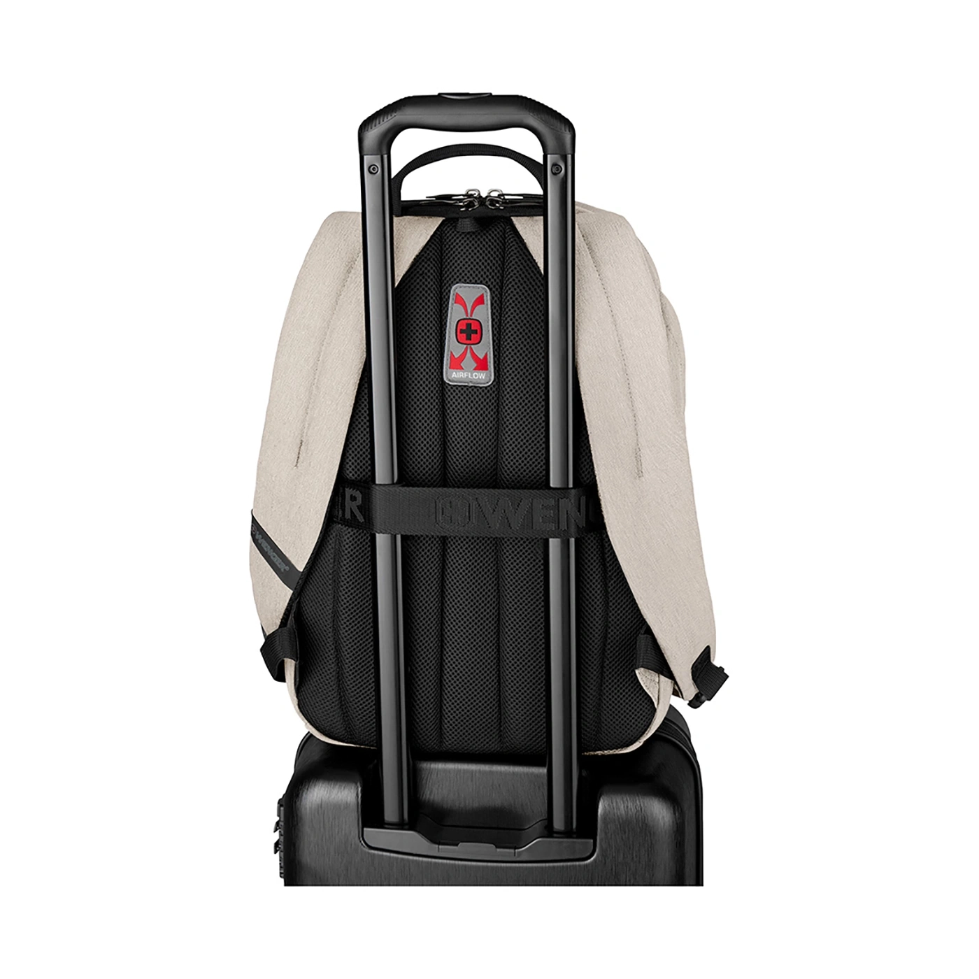 Beige backpack on rolling suitcase with black handle and Airflow logo