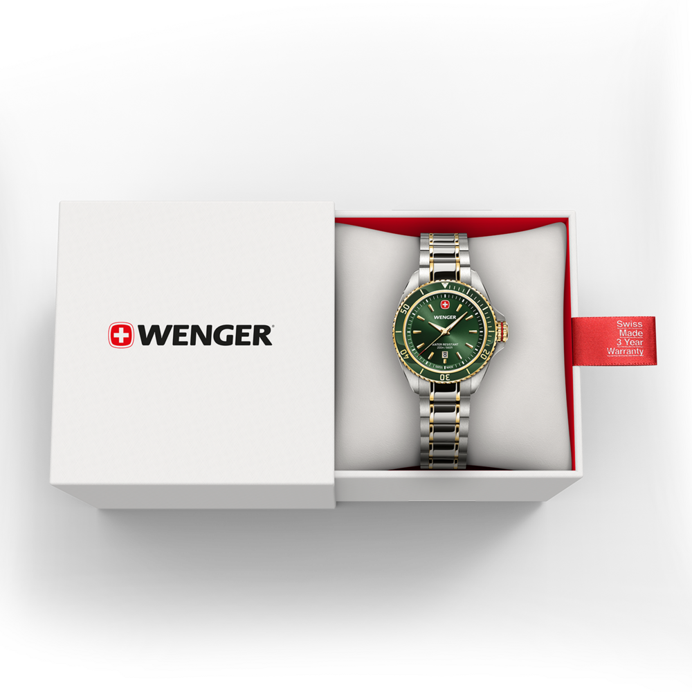 A green Wenger watch with a silver and gold band in a white box with a red warranty tag.