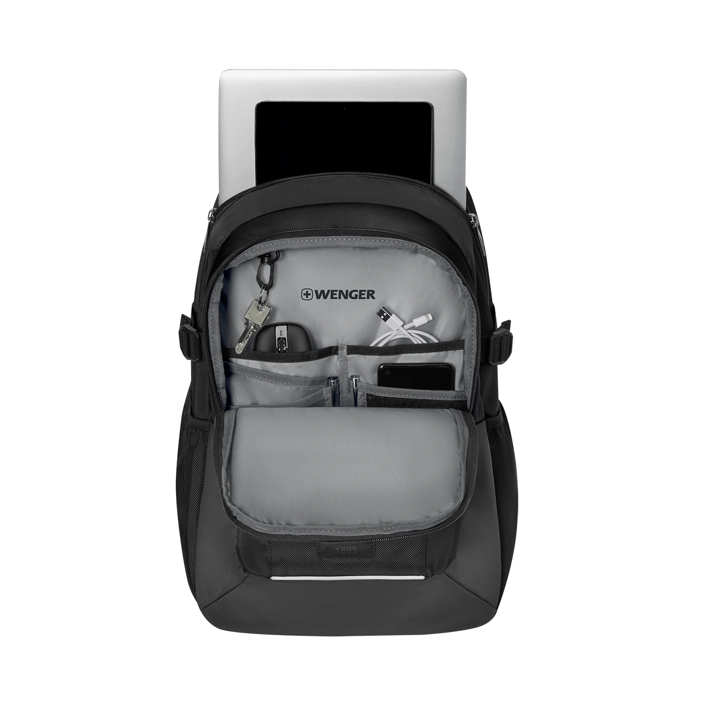 Black backpack with laptop, keys, cables and phone inside.