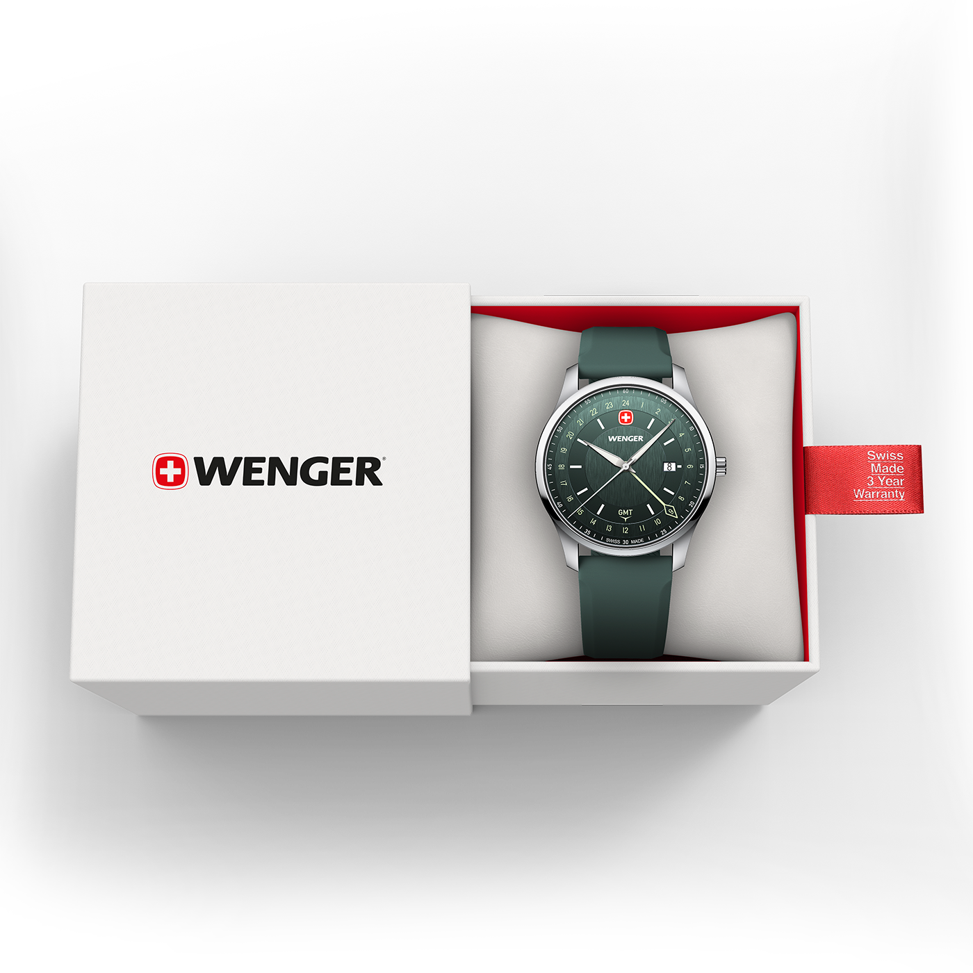 A green Wenger GMT watch in an open white box with a red warranty tag.