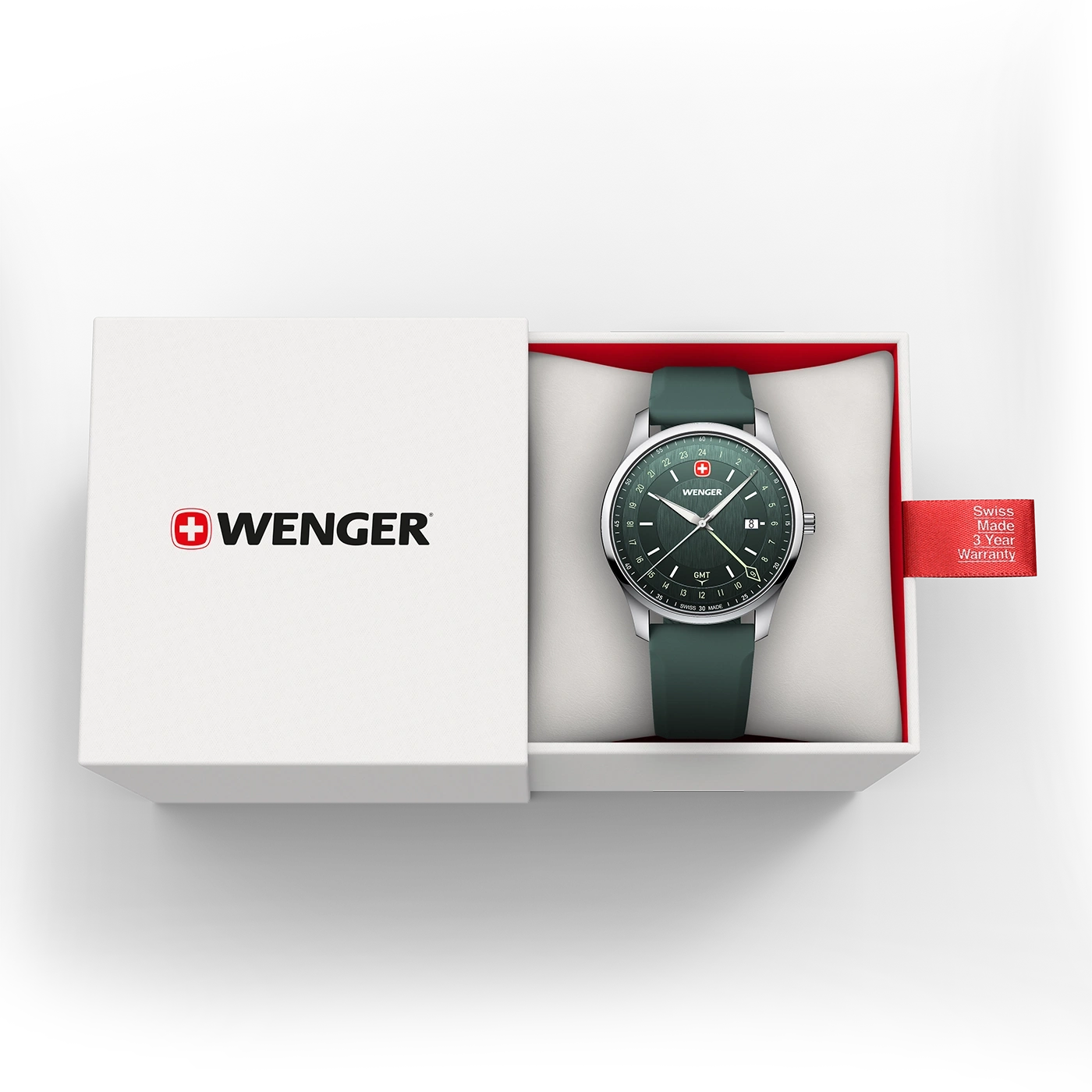 A green Wenger GMT watch in an open white box with a red warranty tag.