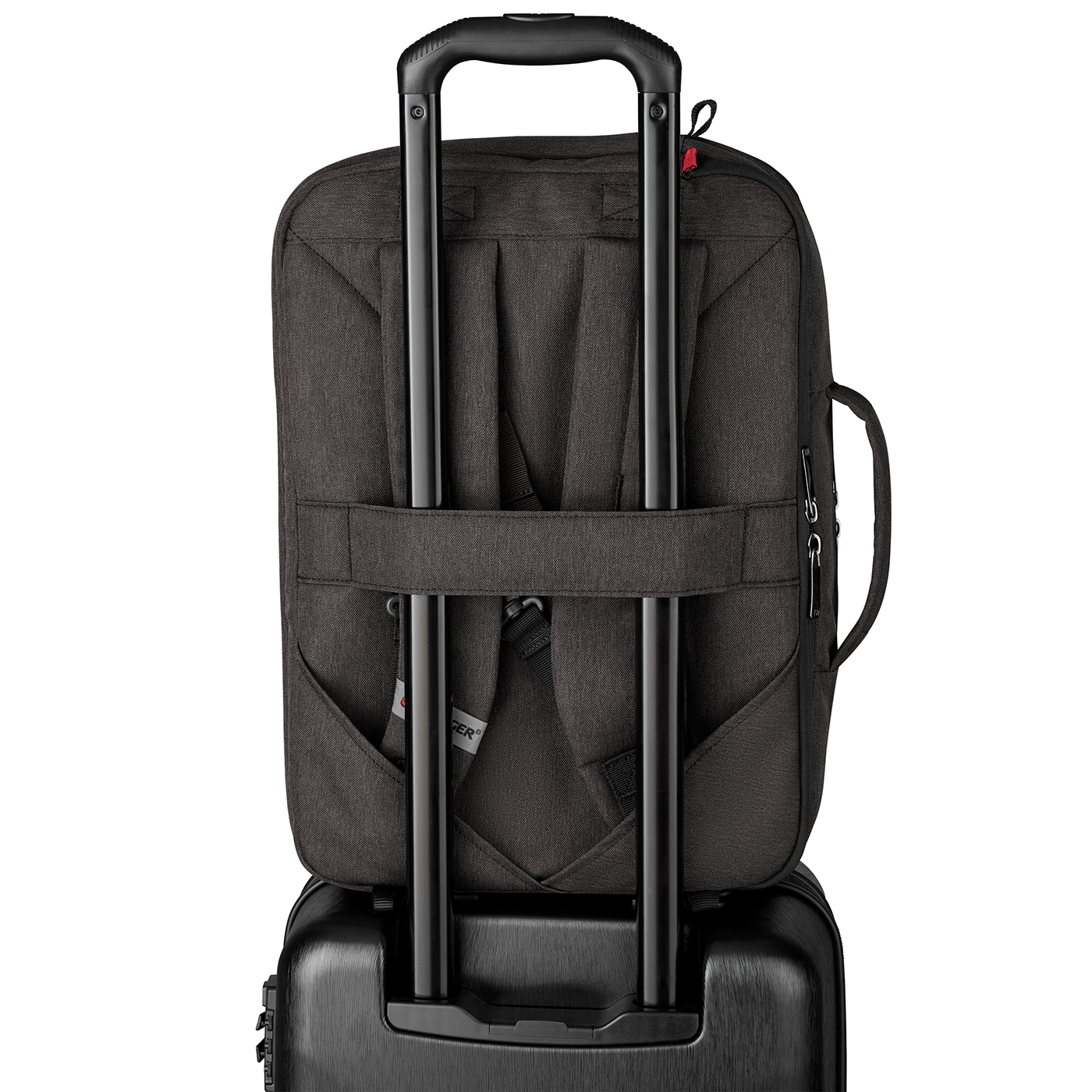 Black backpack on a suitcase with a retractable handle, ready for travel.
