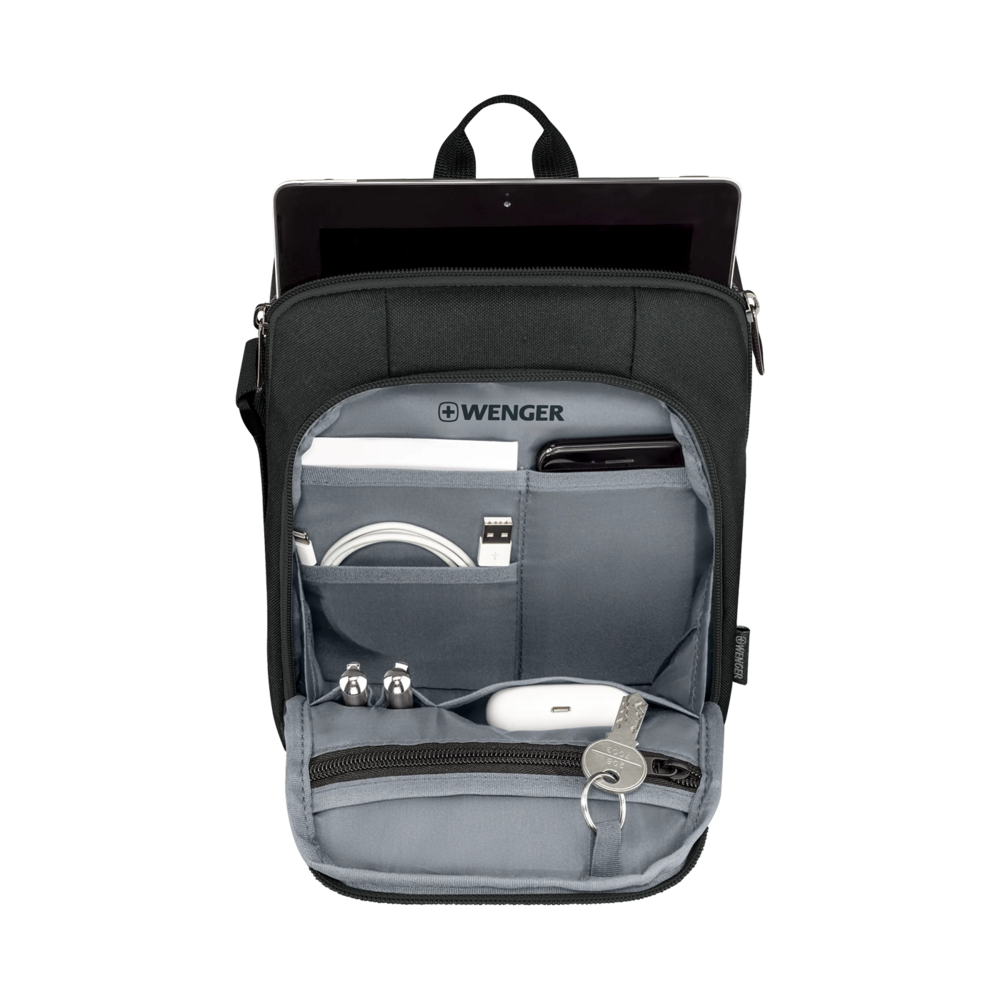 Black shoulder bag with tablet, accessories, and keys inside