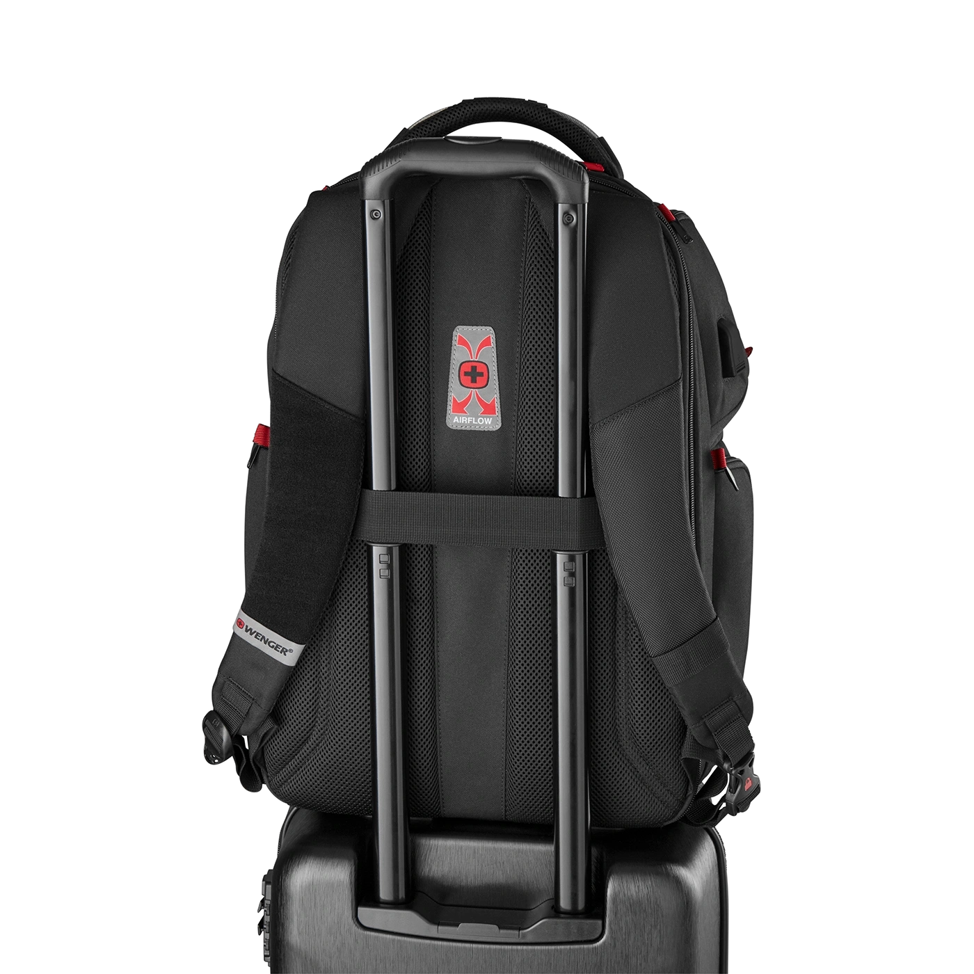 Black backpack with wheels and handle, Airflow system, Wenger logo, on black background.