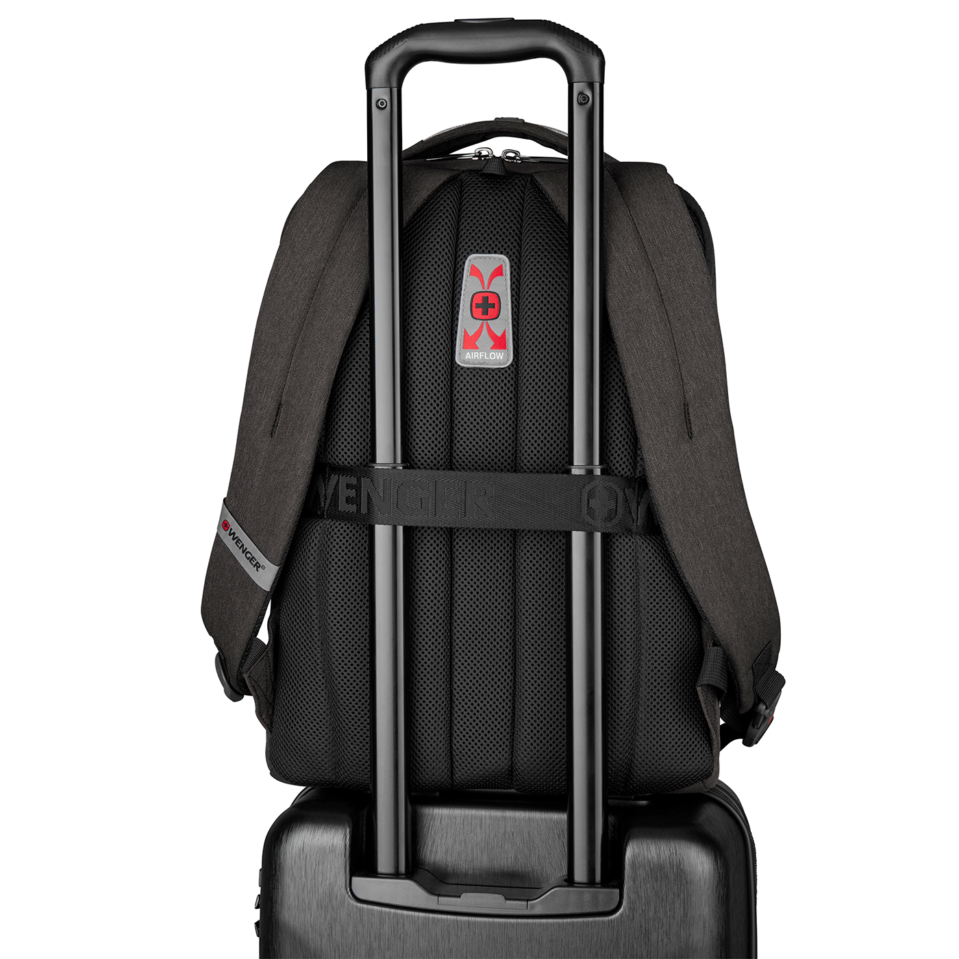 Black backpack with trolley handle, Airflow system, Wenger logo, on black background.