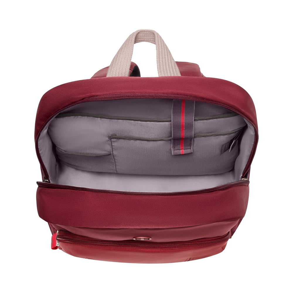 Open red backpack with gray interior and black background, showing details.